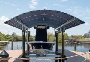 boat under boat lift cover verandah radius beam by waterway | Boat Storage Methods: Why A Boat Lift Cover Is The Best Option