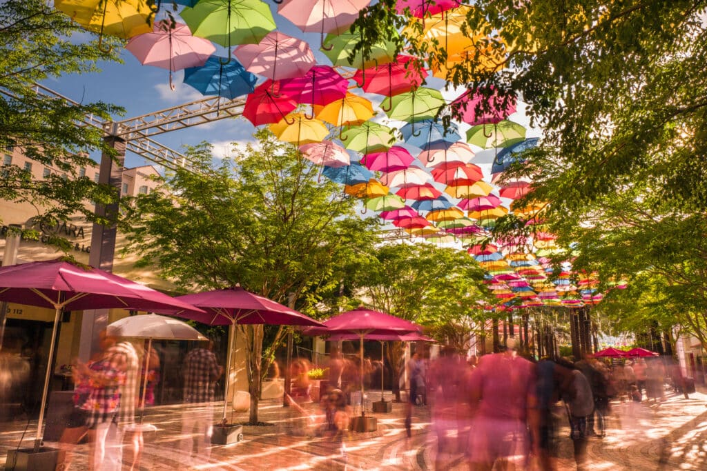 Colorful,Floating,Umbrellas,Hang,Above,The,Street.,Umbrella,Sky,Project