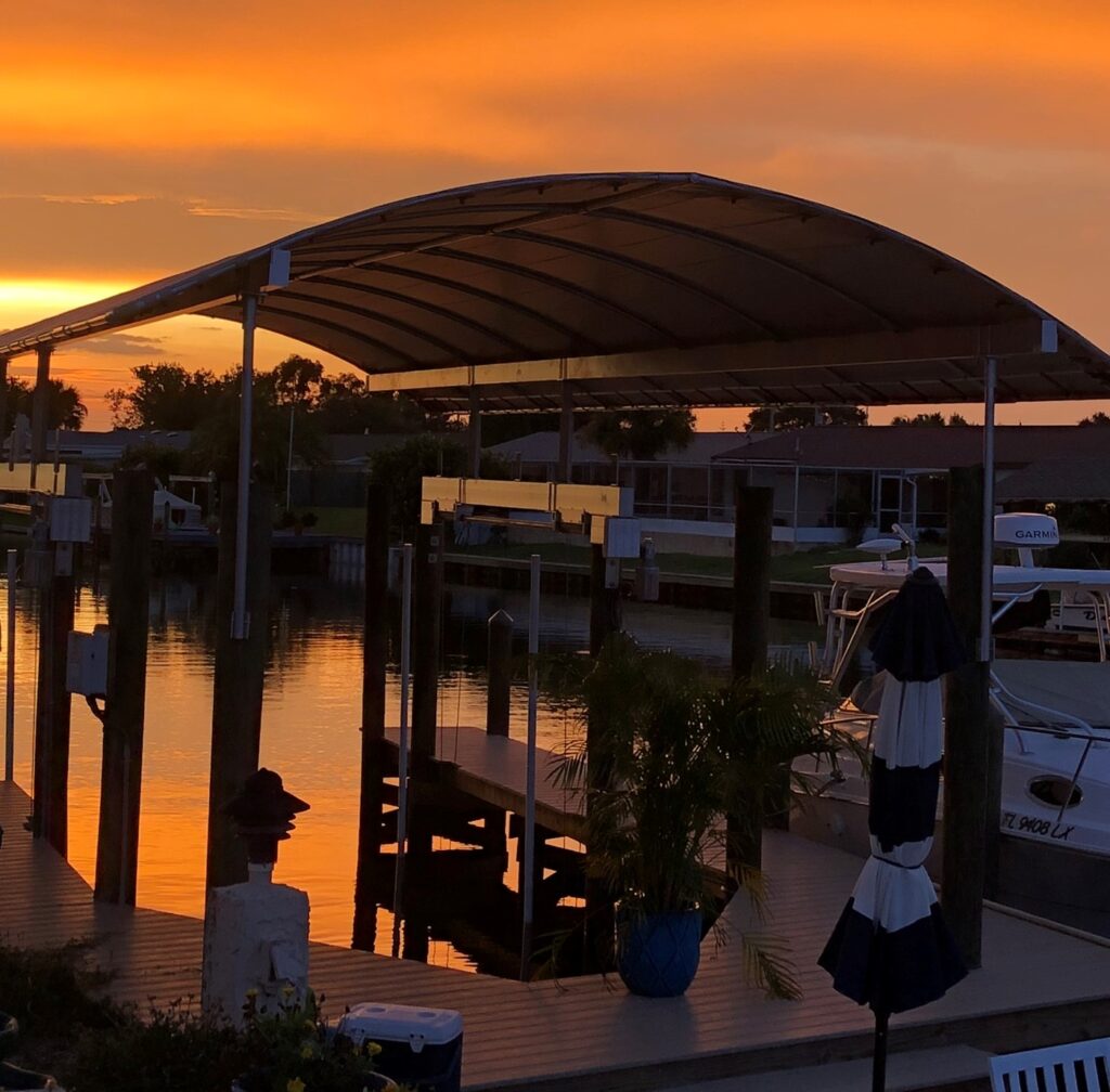 Boat below the canopy as the sun goes down.